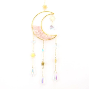 Detail of moon suncatcher with pink crystals, golden sun charm and sparkling prisms