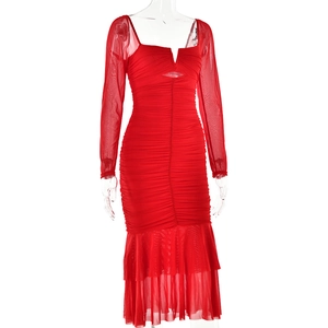 Detail of red square neck dress featuring mesh sleeves and gathered ruched texture