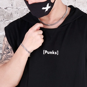 Silver cuban chain necklace and bracelet set shown on model in streetwear style