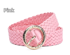 Detail of pink woven PU leather wide belt with a circular gold metal buckle