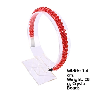 Detail showing 1.4cm wide red crystal beaded headband with multifaceted light reflection