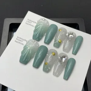 Handmade ocean sea shell press-on nails in grey-green and white with pearl and starfish