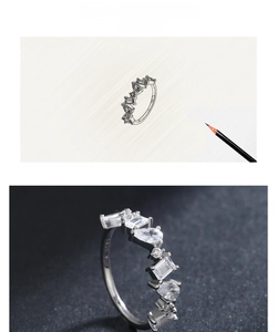 Macro view of S925 silver ring with irregular zircon inlay and design sketch