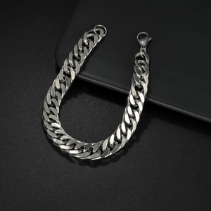 Sleek silver stainless steel Cuban link bracelet with lobster clasp on black background