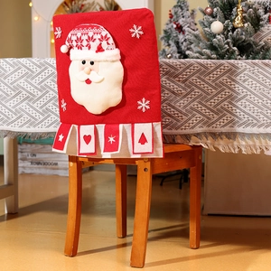 Detail of red Christmas chair cover with 3D Santa Claus and festive knit texture