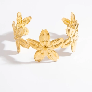 Elegant gold titanium steel open bangle featuring layered flower petal motifs in high polish