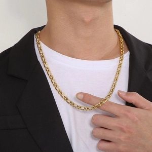 Men's gold-plated stainless steel Figaro chain necklace shown on a male model