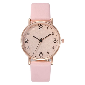 Detail view of the rose gold case and pink leather strap of this elegant quartz watch