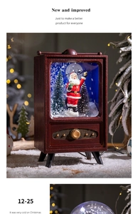 Close-up of retro TV Christmas snow globe with Santa Claus and festive warm lighting