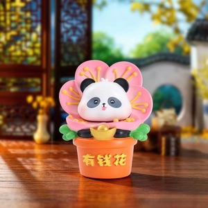 Detailed view of Panda figure holding gold ingot in 'Rich' pot for home decor