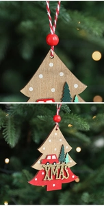 Macro detail of wooden XMAS star ornaments hanging on a decorated Christmas tree