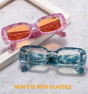 Detail of floral printed thick square sunglasses with colorful 3D patterns and tinted lenses