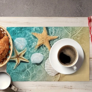Detail of nautical placemat with starfish and shell print on white wood table