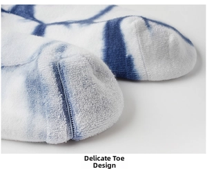 Detailed macro view of tie-dye cotton sock toe with thick terry loop knit for extra warmth