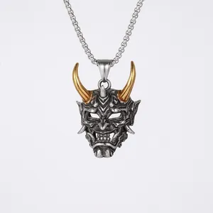 Vintage silver Oni mask pendant with golden horns and a chunky metal chain necklace