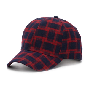 Detail of classic red and blue plaid baseball cap in warm wool-like fabric for autumn