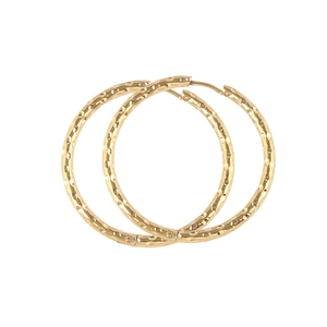 Minimalist gold round hoop earrings with textured diamond-cut design on white background