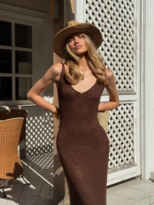 Detailed knit texture of a dark brown V-neck hollow out dress with elegant sun hat