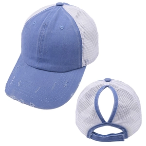 Detail of denim ponytail baseball cap with distressed brim and breathable mesh back