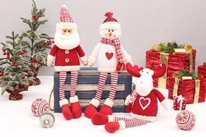 Detail of knitted Santa, Snowman, and Reindeer dolls with long legs for Xmas decor