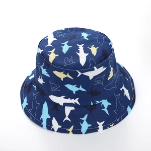 Detailed view of kids navy blue sun hat with colorful cartoon shark patterns and neat stitching