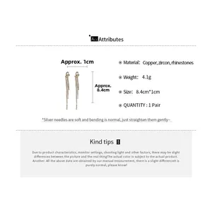 Detail view of gold tassel earrings with knot design, dimensions and material specs
