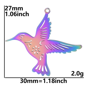 Macro detail of 18K gold stainless steel hummingbird pendant with rainbow plating