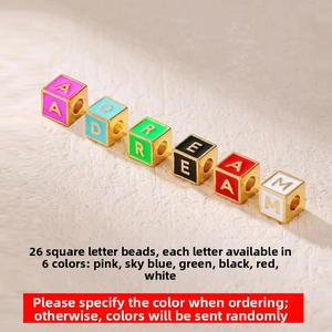 Macro view of colorful enamel square alphabet beads for DIY jewelry making