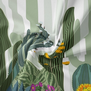 Detail of bohemian tapestry featuring cactus desert plants and soft fabric texture