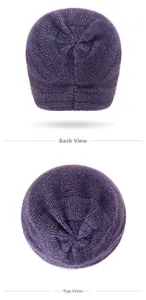 Detailed close-up of dark purple knitted winter hat showing back and top texture views