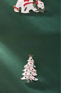 Detail of Christmas polar bear and rhinestone tree brooches with size measurements