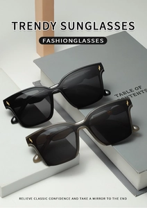 Detail of square oversized sunglasses with golden lightning metal accents on the frames
