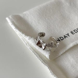 Macro shot of S925 sterling silver ring with irregular textured finish and S925 hallmark
