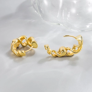 Polished gold twisted rope hoop earrings in C-shape design with pin closure for women