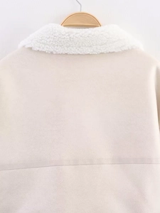 Rear view detail of beige suede biker jacket with white faux shearling collar