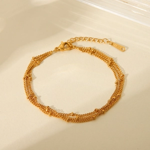 Three-layer 18K gold plated stainless steel chain bracelet with bead details and lobster clasp
