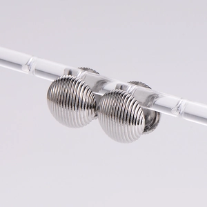 Elegant silver stainless steel round stud earrings with a shell stripe texture on light grey