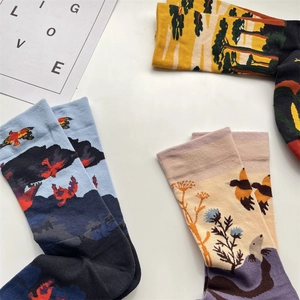 Detailed macro view of high-quality combed cotton socks with artistic mountain and floral jacquard