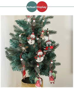 Detailed view of wooden Santa, Snowman and Reindeer ornaments hanging on a Christmas tree