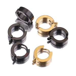 Polished black and gold stainless steel DIY hoop earrings displayed on a mirror surface