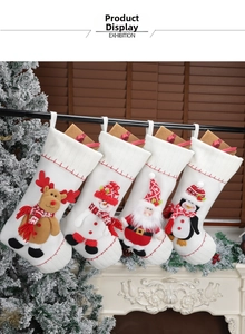 Set of four knitted Christmas stockings with 3D reindeer and Santa characters