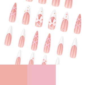 Pink and white long stiletto press-on nails with 3D bows, pearls and flower designs