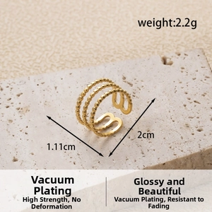 Detailed view of triple-layered golden beaded ring with an adjustable open back design