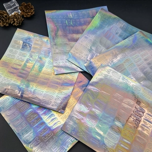 Macro detail of holographic alphabet stickers featuring vibrant rainbow laser finish