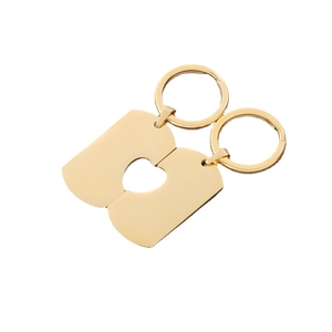 Polished gold titanium steel heart puzzle keychains for couples, custom engravable tags