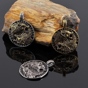 Viking wolf head pendants with runic engraving in silver, gold, and bicolor finishes