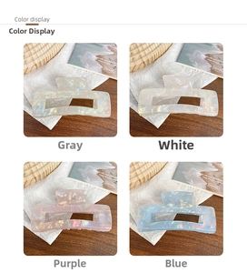 Detailed grid view of square iridescent hair claws in grey, white, purple and blue