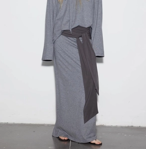 Detailed view of the dark grey knit skirt waistband with wide adjustable tie design