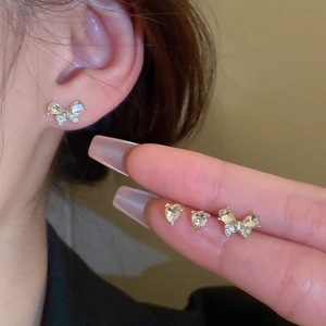Minimalist silver butterfly and heart stud earrings set with sparkling crystals for women