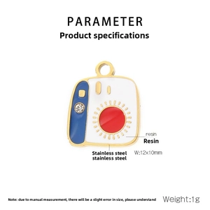 Detailed macro view of a 12x10mm gold stainless steel and resin camera charm with crystal